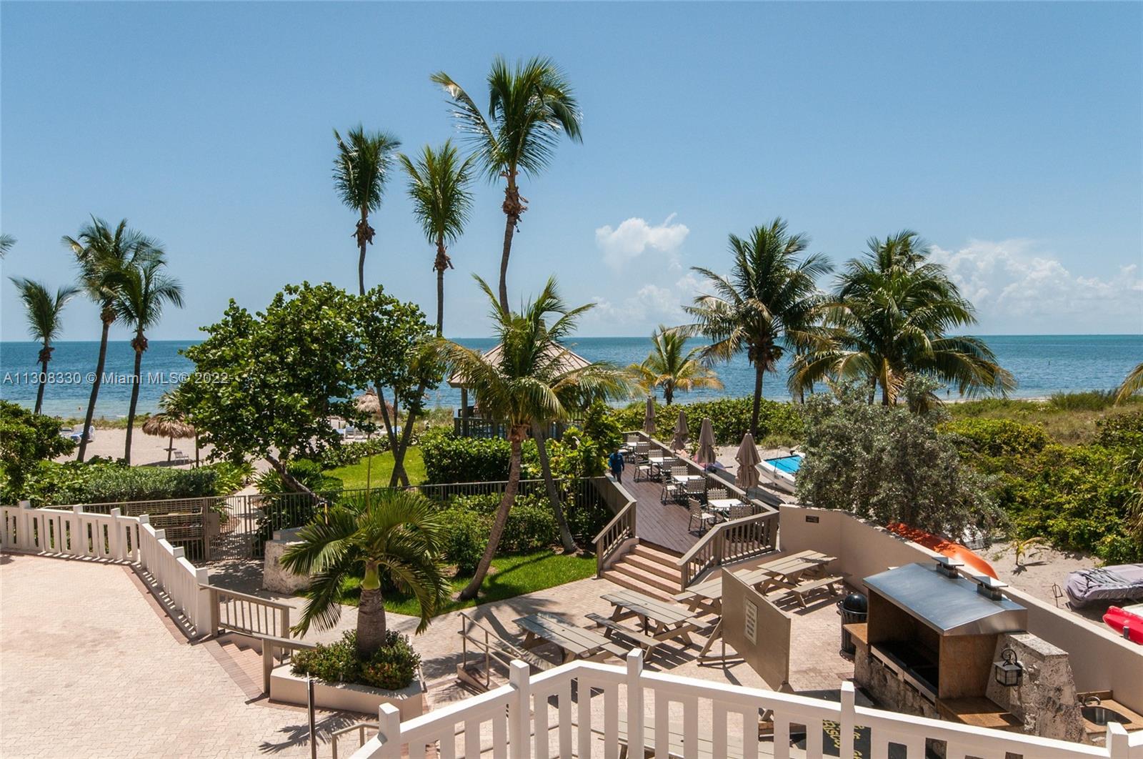 1121 Crandon Boulevard, Unit E1101 Key Biscayne, FL 33149 - Photo 23 of 31 a view of a yard with palm trees