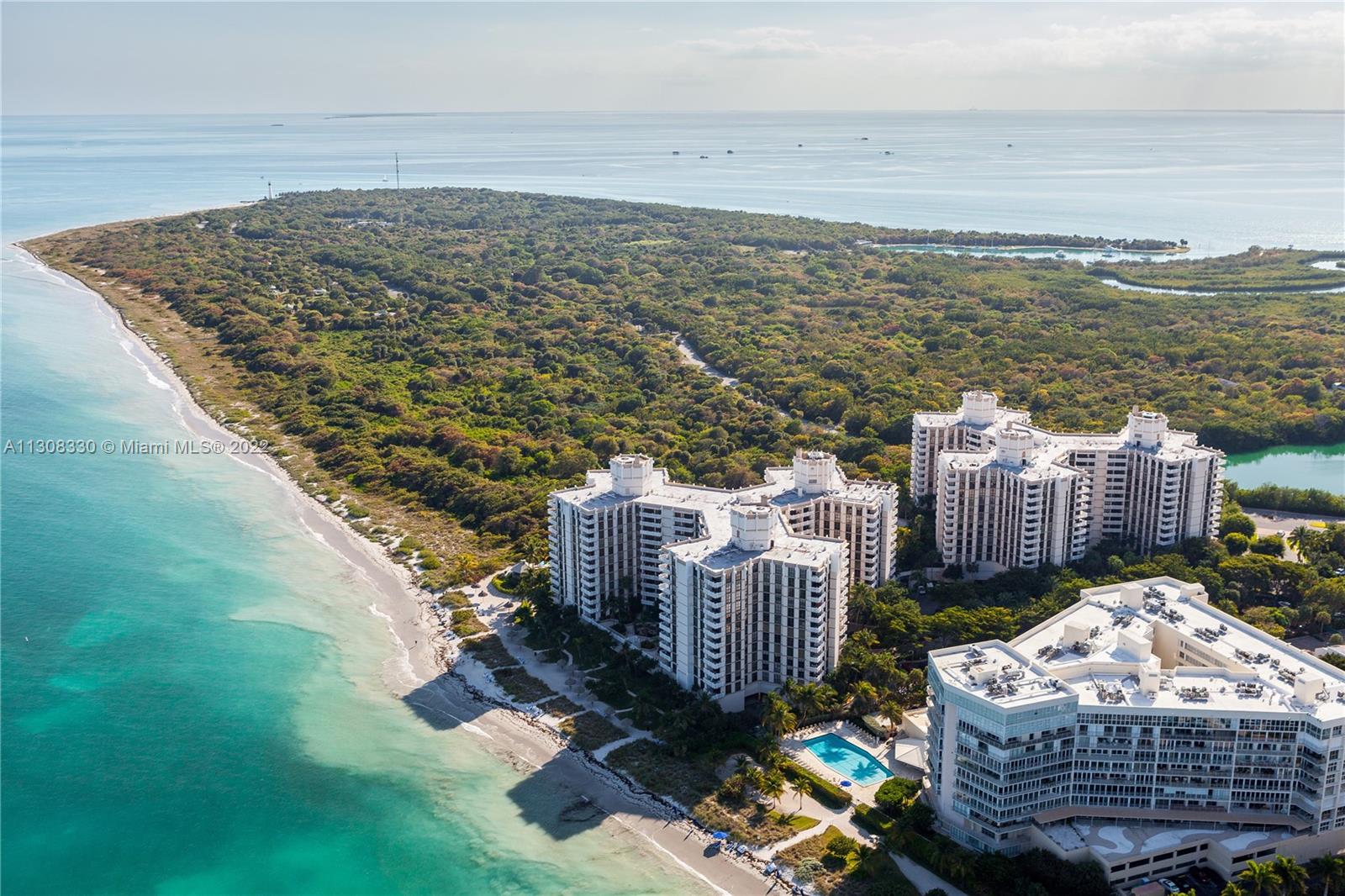 1121 Crandon Boulevard, Unit E1101 Key Biscayne, FL 33149 - Photo 30 of 31 a view of a roof deck with lawn chairs and ocean view