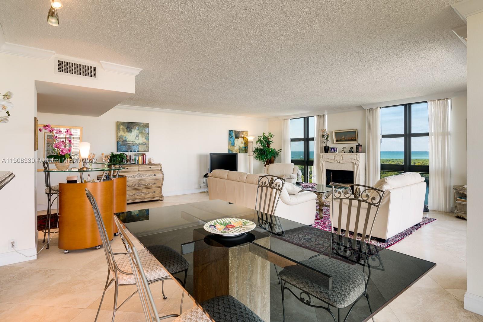 1121 Crandon Boulevard, Unit E1101 Key Biscayne, FL 33149 - Photo 6 of 31 a living room with furniture and wooden floor