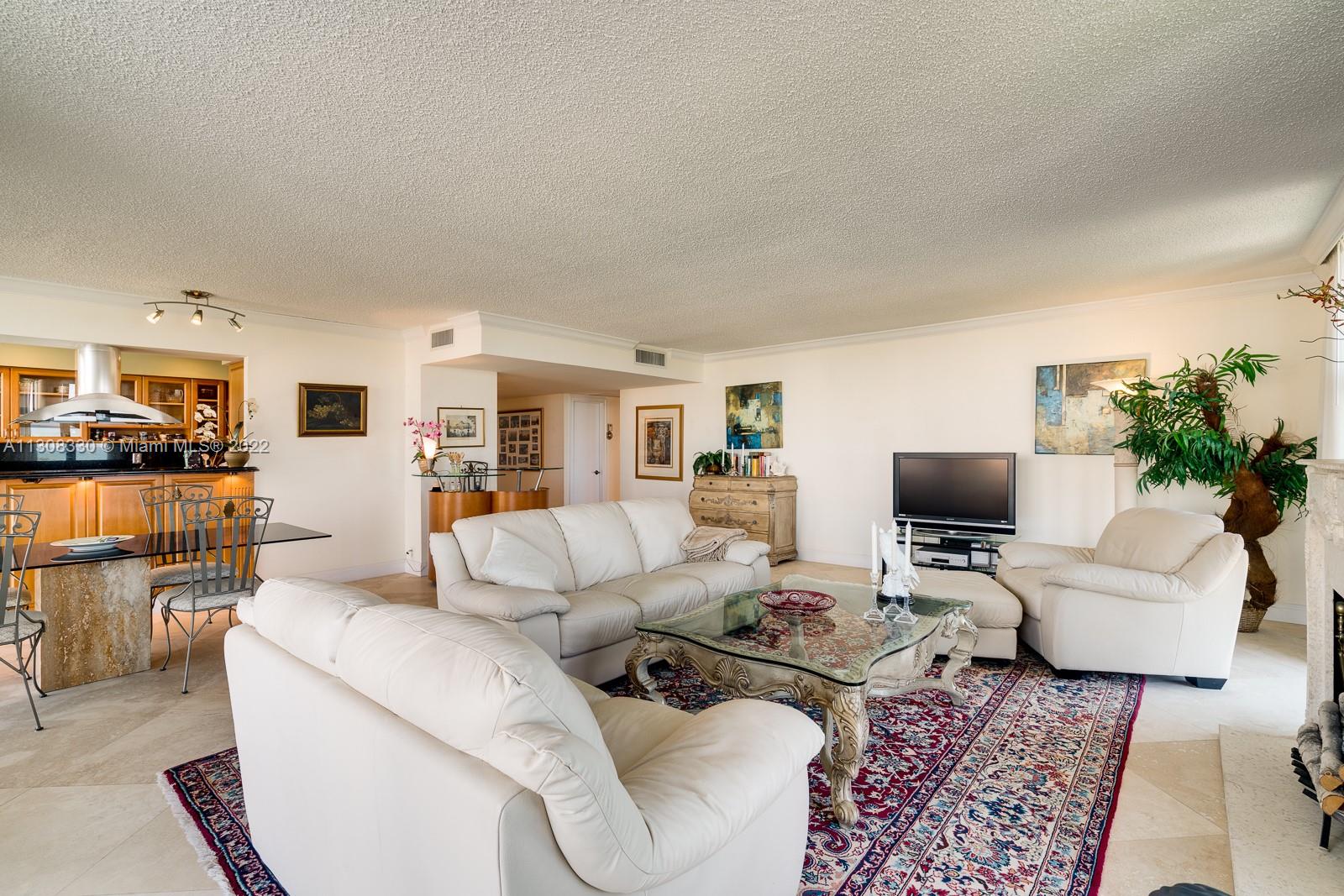 1121 Crandon Boulevard, Unit E1101 Key Biscayne, FL 33149 - Photo 9 of 31 a living room with furniture and a couch
