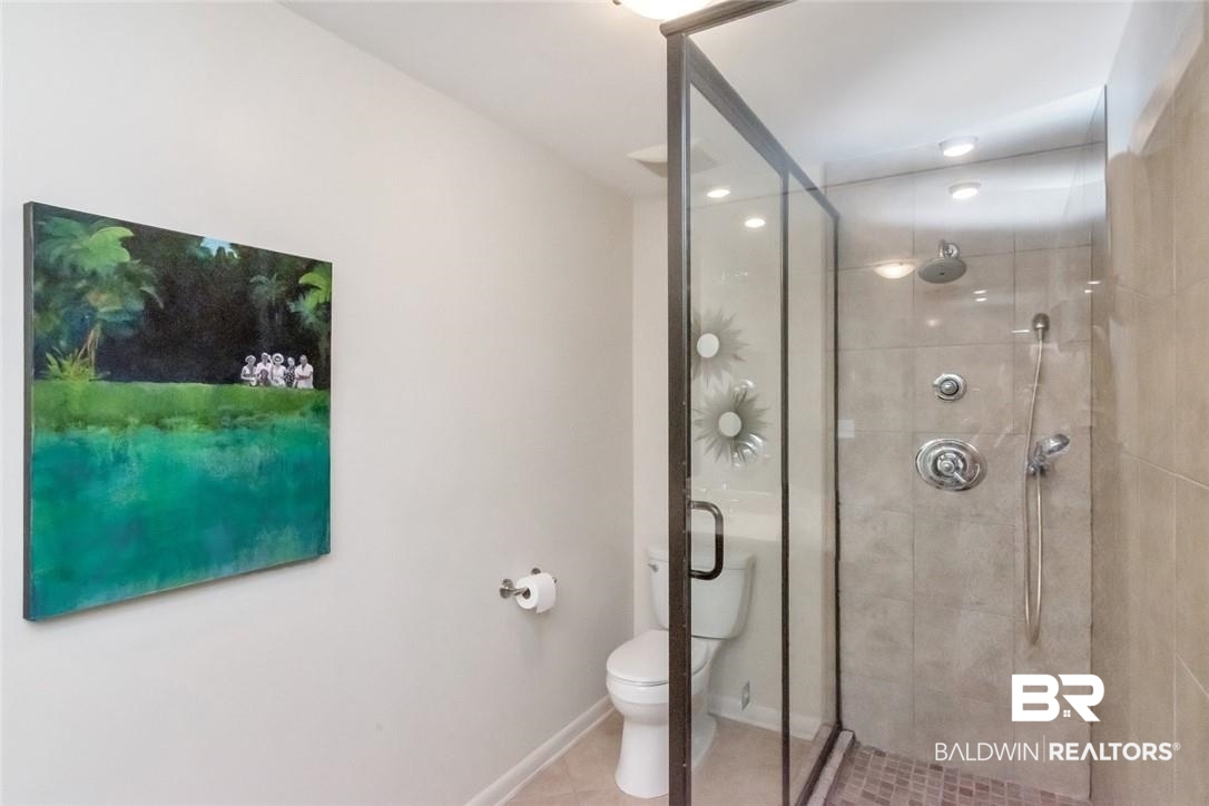 305 Fern Hill Court Mobile, AL 36608 - Photo 26 of 53 Bathroom featuring a shower with shower door, toilet, and tile patterned floors