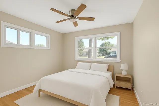 a bedroom with a large bed and a window