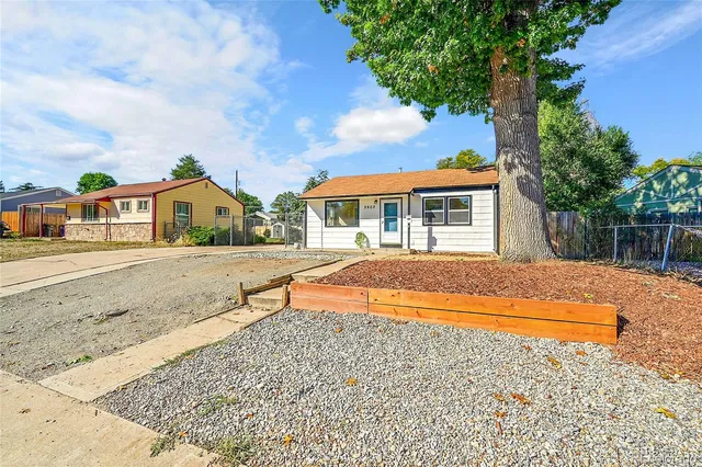 a house with swimming pool in front of it