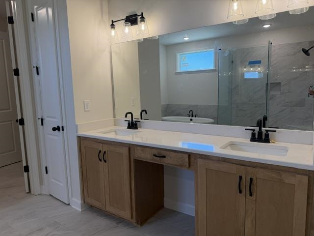 210 Drake Drive Collierville, TN 38017 - Photo 14 of 19 a bathroom with a double vanity sink a and mirror