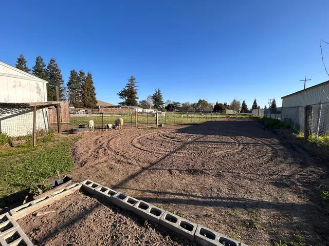 a view of outdoor space sign and front of house