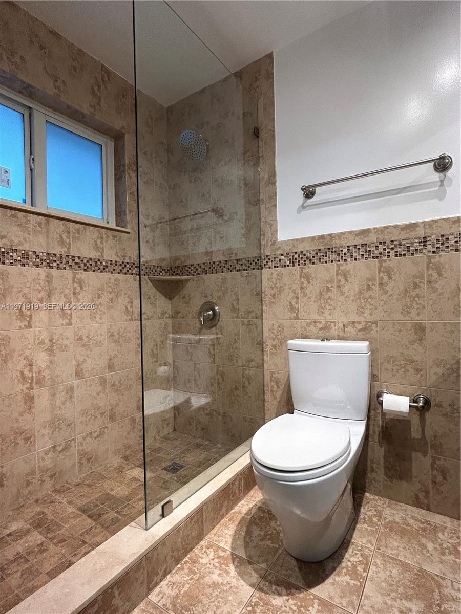 230 Southwest 30th Avenue, Unit 230 Miami, FL 33135 - Photo 12 of 22 a bathroom with a toilet and a shower