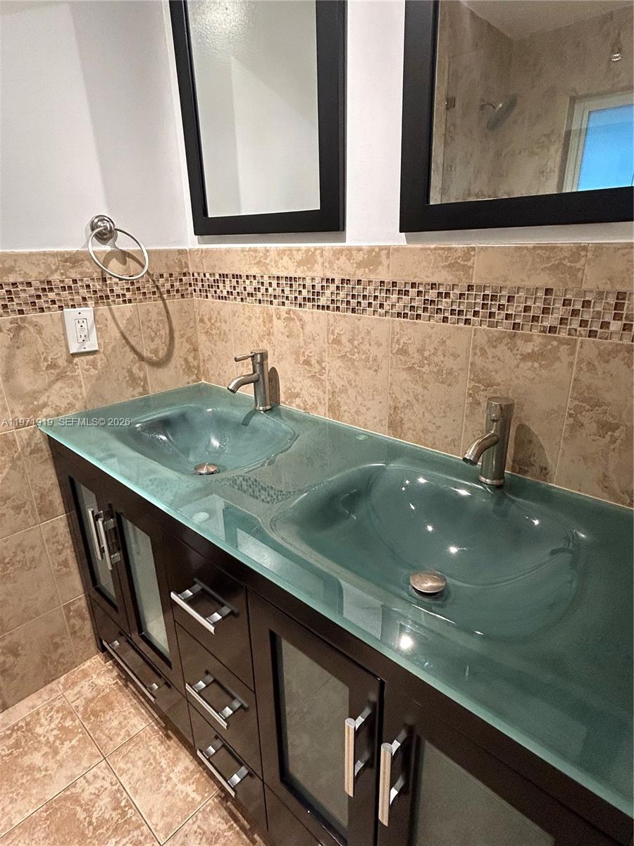 230 Southwest 30th Avenue, Unit 230 Miami, FL 33135 - Photo 13 of 22 a view of a sink and mirror
