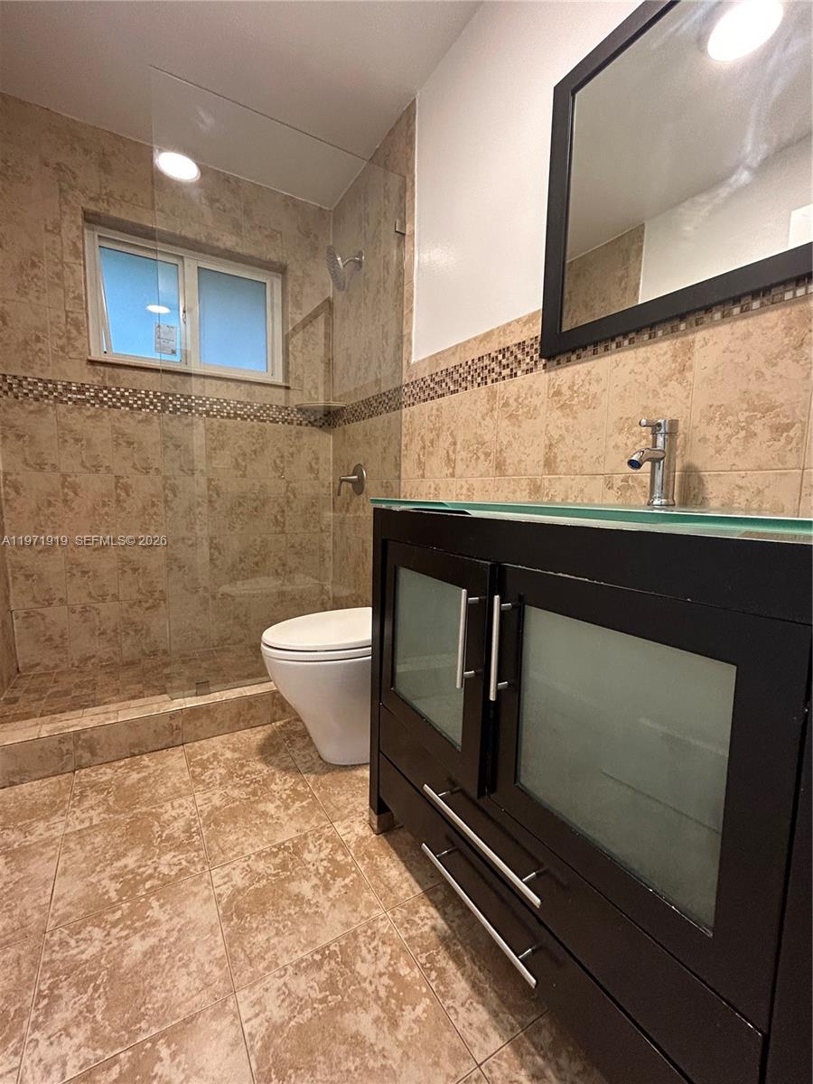 230 Southwest 30th Avenue, Unit 230 Miami, FL 33135 - Photo 16 of 22 a bathroom with a sink and a mirror