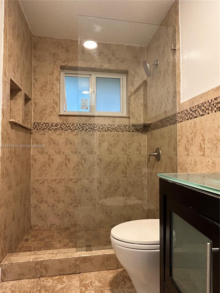 230 Southwest 30th Avenue, Unit 230 Miami, FL 33135 - Photo 18 of 22 a bathroom with a sink a toilet and shower