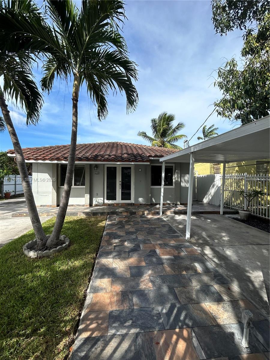 230 Southwest 30th Avenue, Unit 230 Miami, FL 33135 - Photo 19 of 22 a view of a house with backyard porch and sitting area
