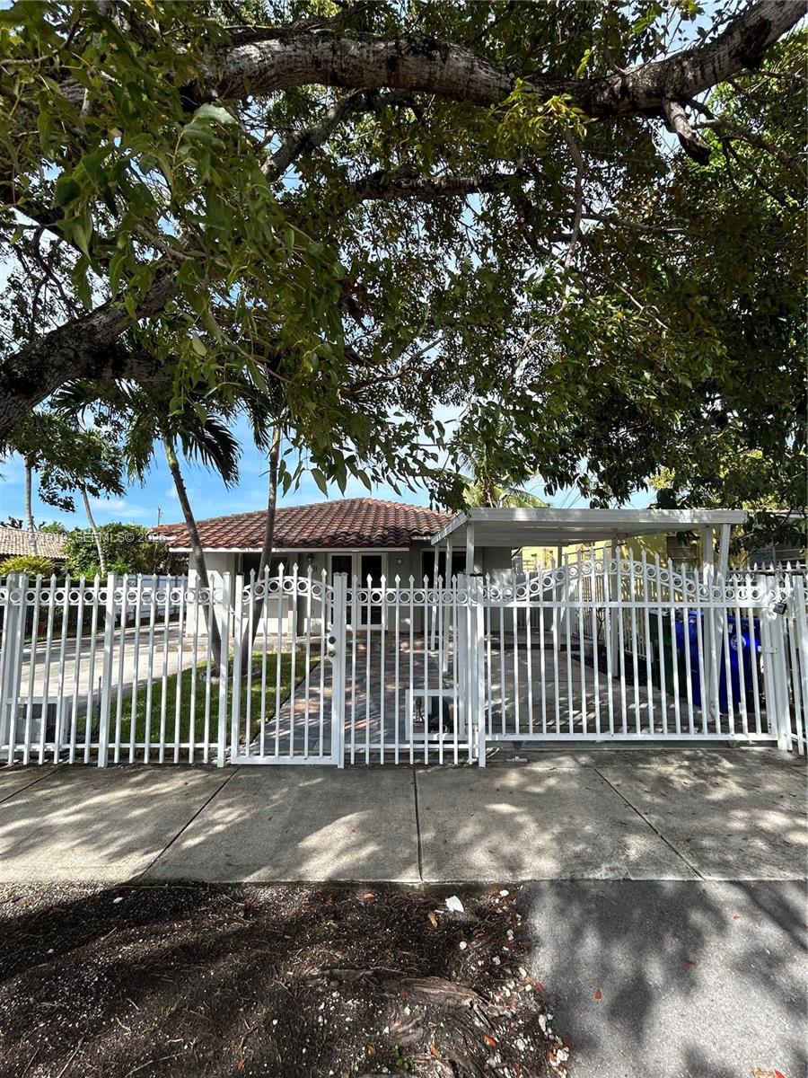 230 Southwest 30th Avenue, Unit 230 Miami, FL 33135 - Photo 21 of 22 a view of a wooden fence