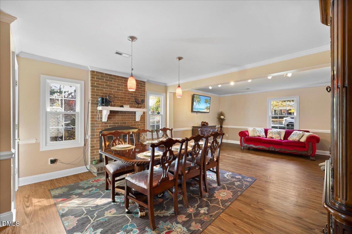 2323 Buckingham Road Burlington, NC 27217 - Photo 19 of 33 a view of a dining room with furniture and chandelier