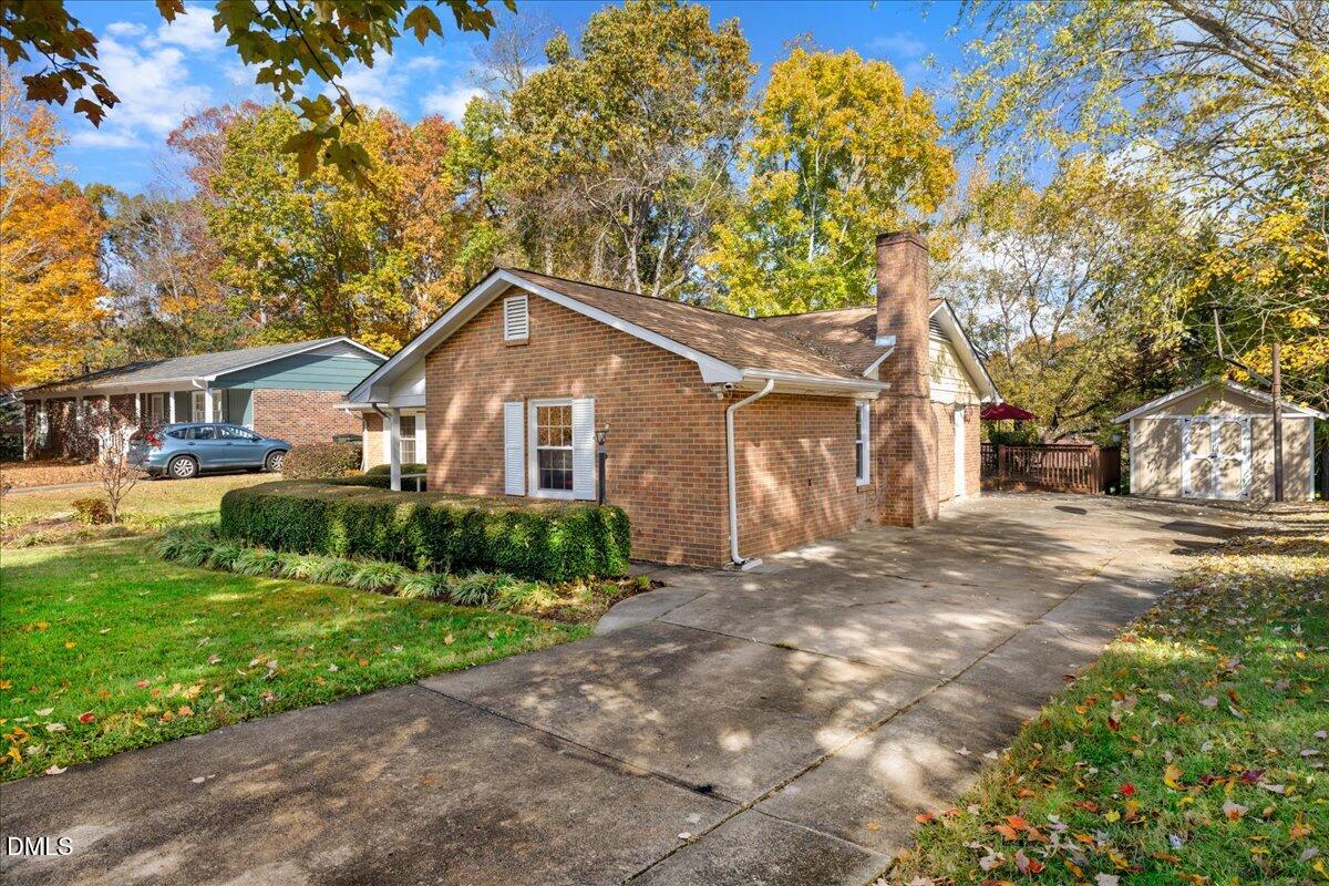 2323 Buckingham Road Burlington, NC 27217 - Photo 2 of 33 a front view of a house with a yard and garage