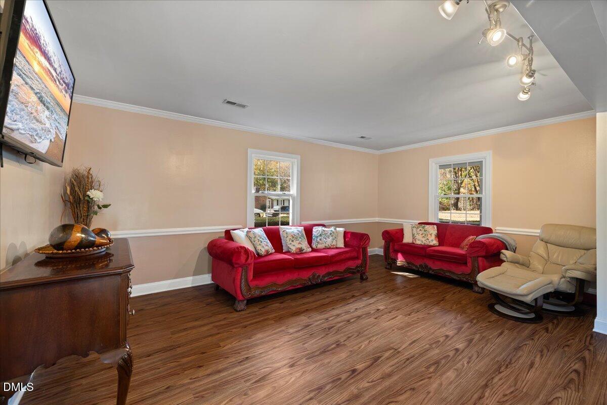 2323 Buckingham Road Burlington, NC 27217 - Photo 21 of 33 a living room with furniture and a flat screen tv