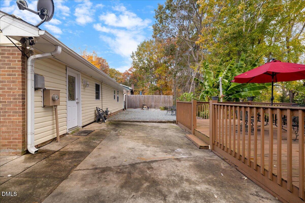 2323 Buckingham Road Burlington, NC 27217 - Photo 24 of 33 a view of a white house with wooden fence