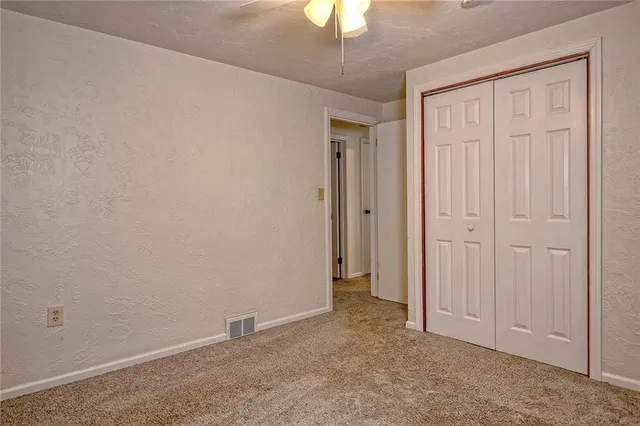 an empty room with a hallway