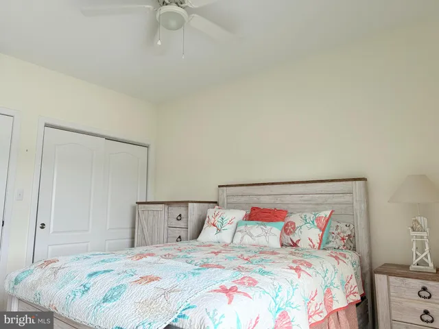 a bedroom with a large bed and a dresser