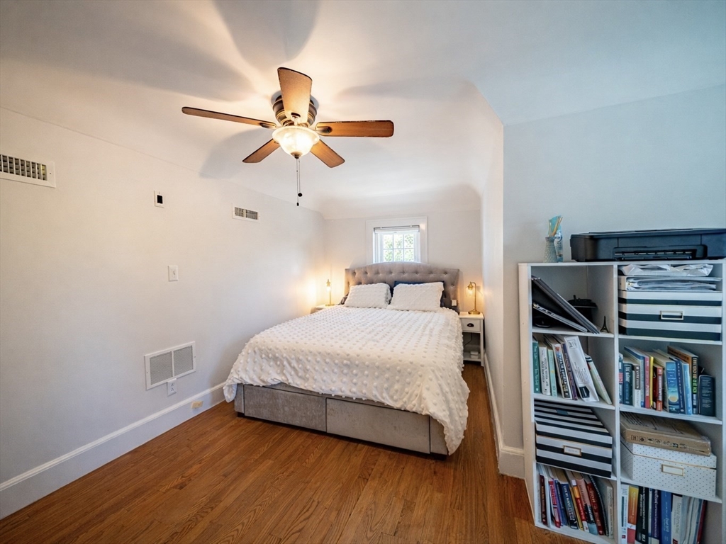10 Guild Road Saugus, MA 01906 - Photo 25 of 32 a bedroom with a bed and a book shelf
