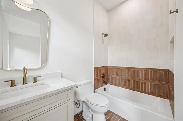 an empty room with wooden cabinet chandelier fan and windows