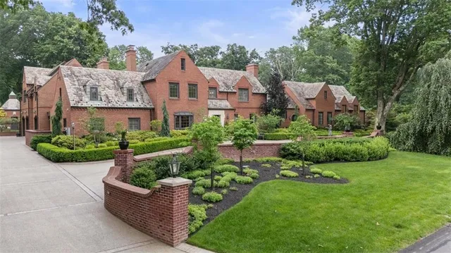 a front view of house with yard and green space