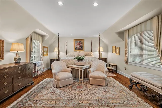 a very nice looking room with a large window and couch