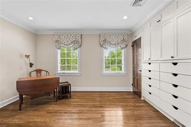 a very nice looking dining room with chandelier