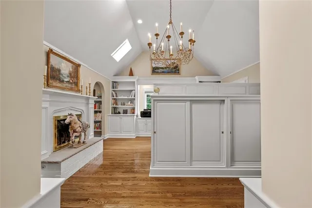 a view of an entryway with wooden floor