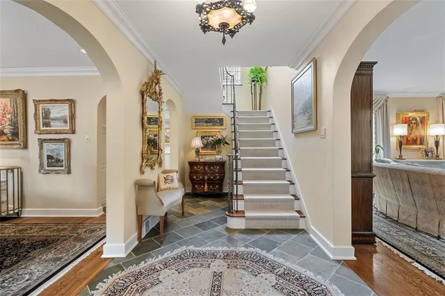 a view of an entryway with wooden floor