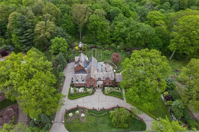 an aerial view of a house with outdoor space
