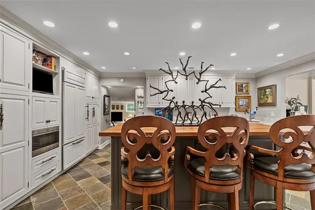 a view of a livingroom with furniture and a flat screen tv
