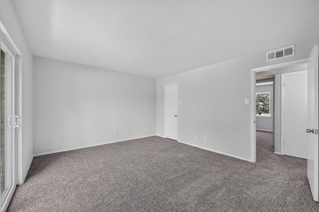 1801 East Grauwyler Road, Unit 101 Irving, TX 75061 - Photo 23 of 39 a view of an empty room and closet