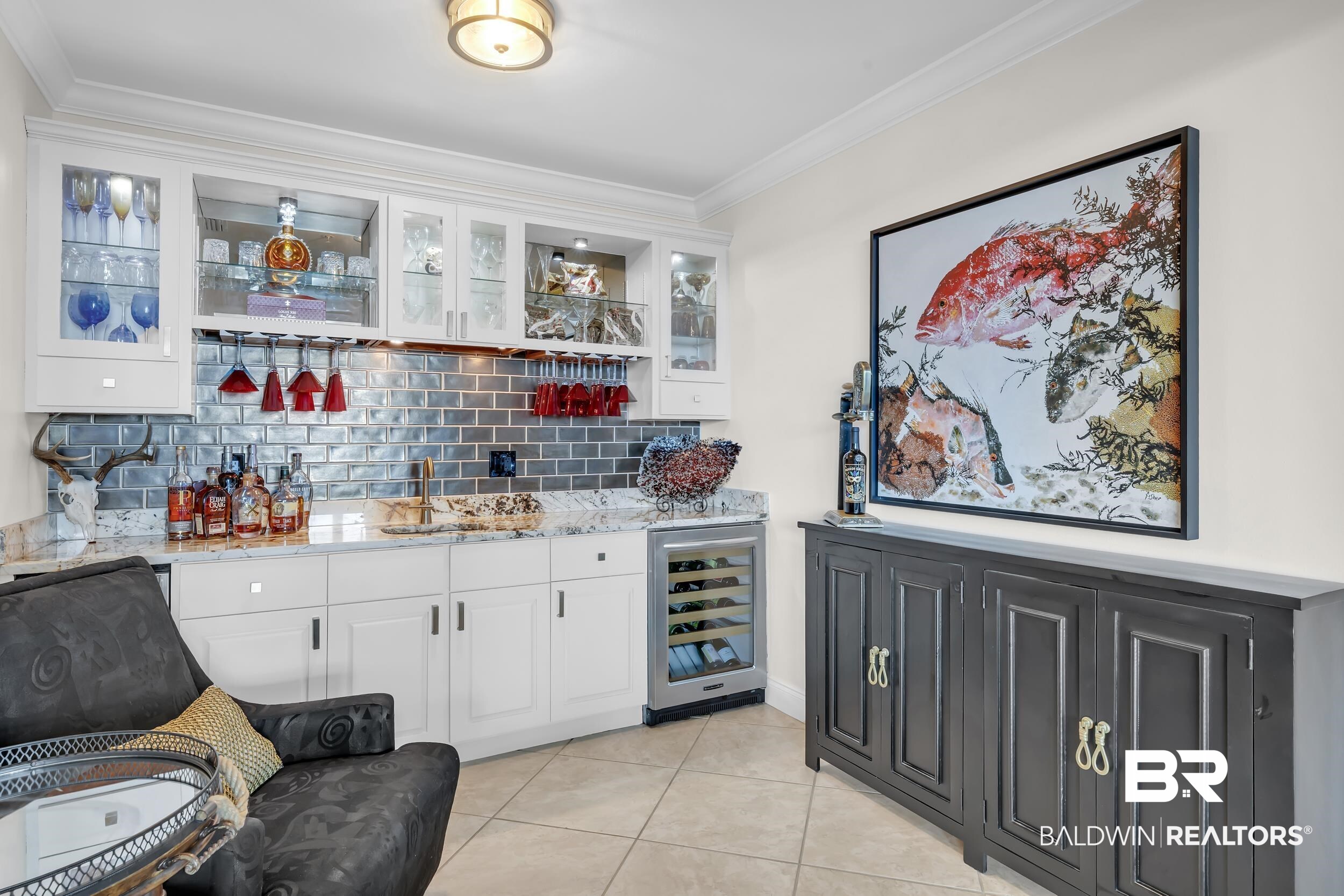 28250 Canal Road, Unit 307 Orange Beach, AL 36561 - Photo 21 of 56 Indoor wet bar featuring white cabinets, glass fronted cabinets, crown molding, wine cooler, and light stone countertops