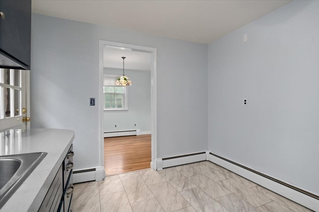 124 Turtle Pond Parkway Boston, MA 02136 - Photo 11 of 39 a view of a kitchen cabinets and wooden floor