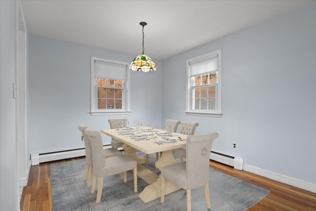 124 Turtle Pond Parkway Boston, MA 02136 - Photo 14 of 39 a view of a dining room with furniture and window