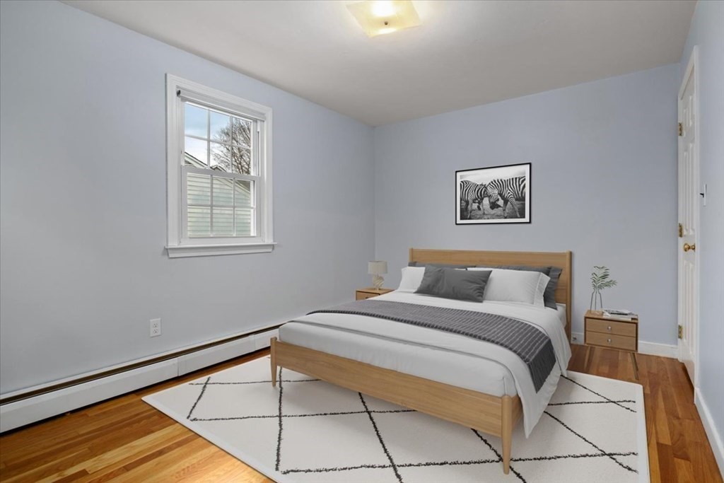 124 Turtle Pond Parkway Boston, MA 02136 - Photo 17 of 39 a bedroom with a bed and a window