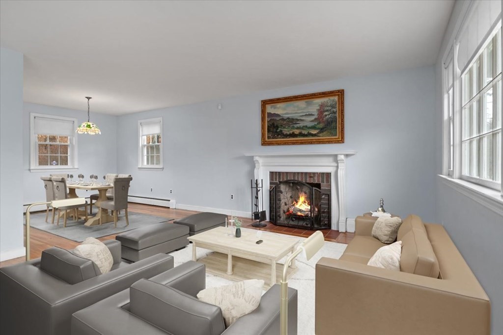124 Turtle Pond Parkway Boston, MA 02136 - Photo 2 of 39 a living room with furniture a fireplace and a flat screen tv