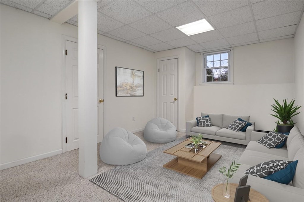 124 Turtle Pond Parkway Boston, MA 02136 - Photo 23 of 39 a living room with furniture and a potted plant