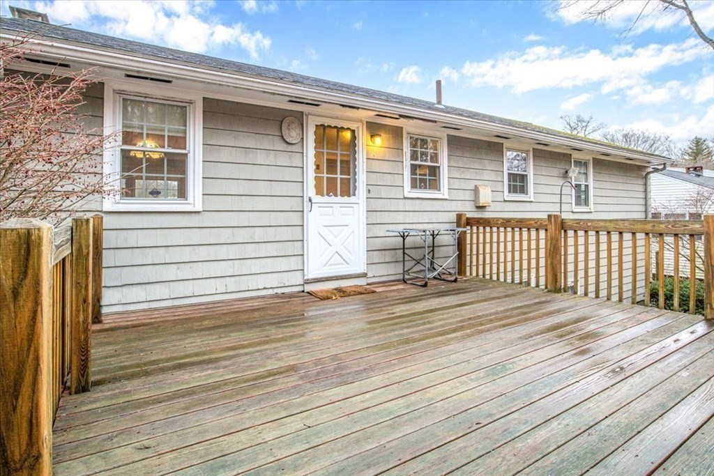 124 Turtle Pond Parkway Boston, MA 02136 - Photo 32 of 39 a front view of a house with a wooden deck