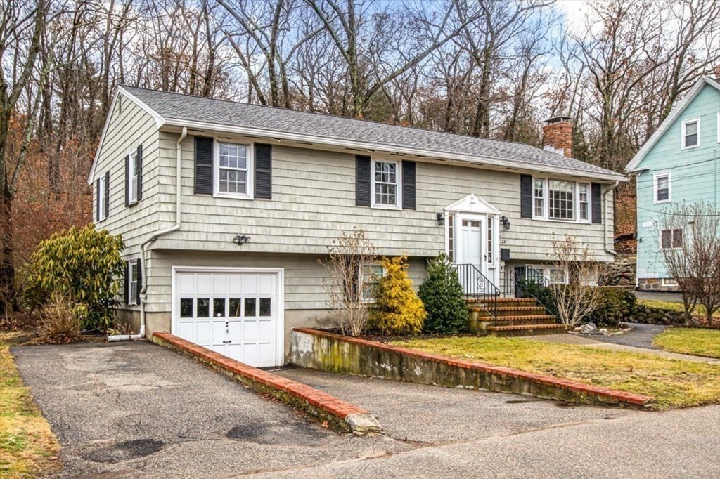 124 Turtle Pond Parkway Boston, MA 02136 - Photo 38 of 39 a view of house with outdoor space and of trees