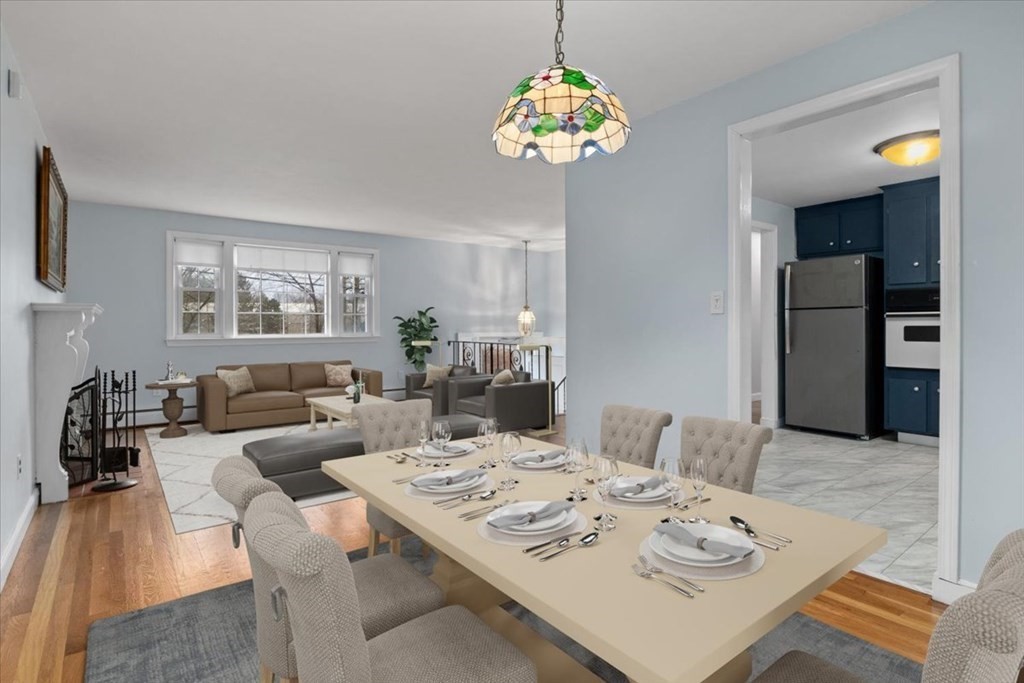 124 Turtle Pond Parkway Boston, MA 02136 - Photo 4 of 39 a view of a dining room with furniture a chandelier and wooden floor