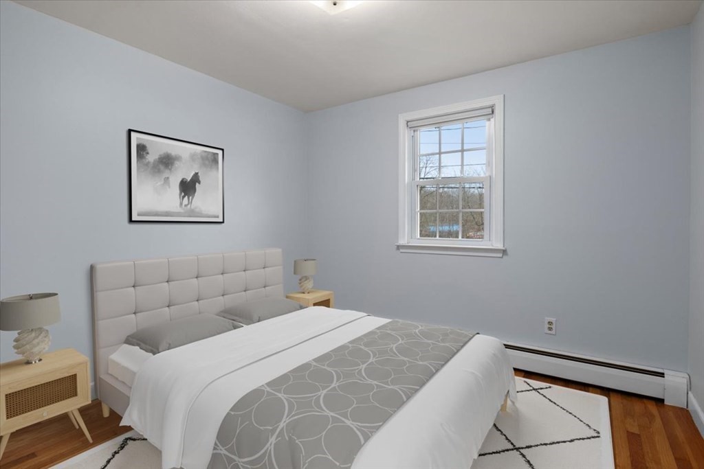 124 Turtle Pond Parkway Boston, MA 02136 - Photo 6 of 39 a bedroom with a bed and a window