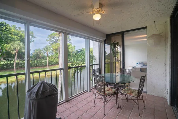a room with dining table and chairs