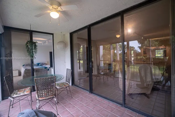 a patio with table and chairs
