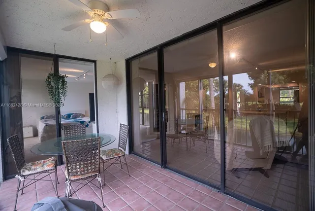 a patio with table and chairs