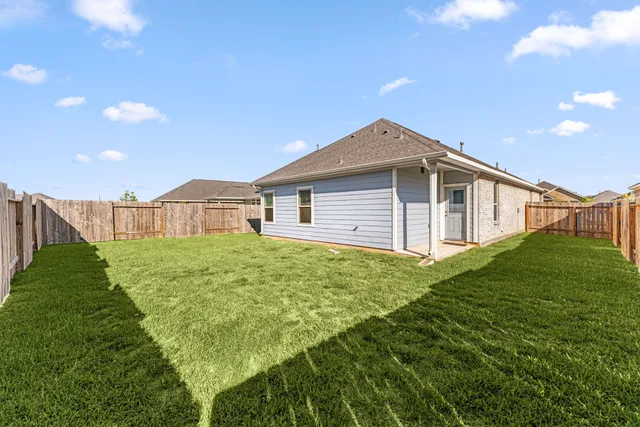 a backyard of a house with lots of green space
