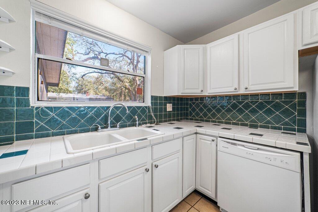 6147 Temple Road Jacksonville, FL 32217 - Photo 13 of 36 a kitchen with a sink and cabinets