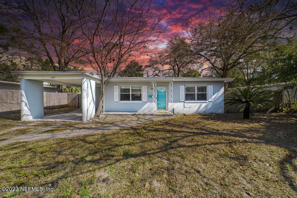6147 Temple Road Jacksonville, FL 32217 - Photo 2 of 36 a view of a house with a yard and large tree