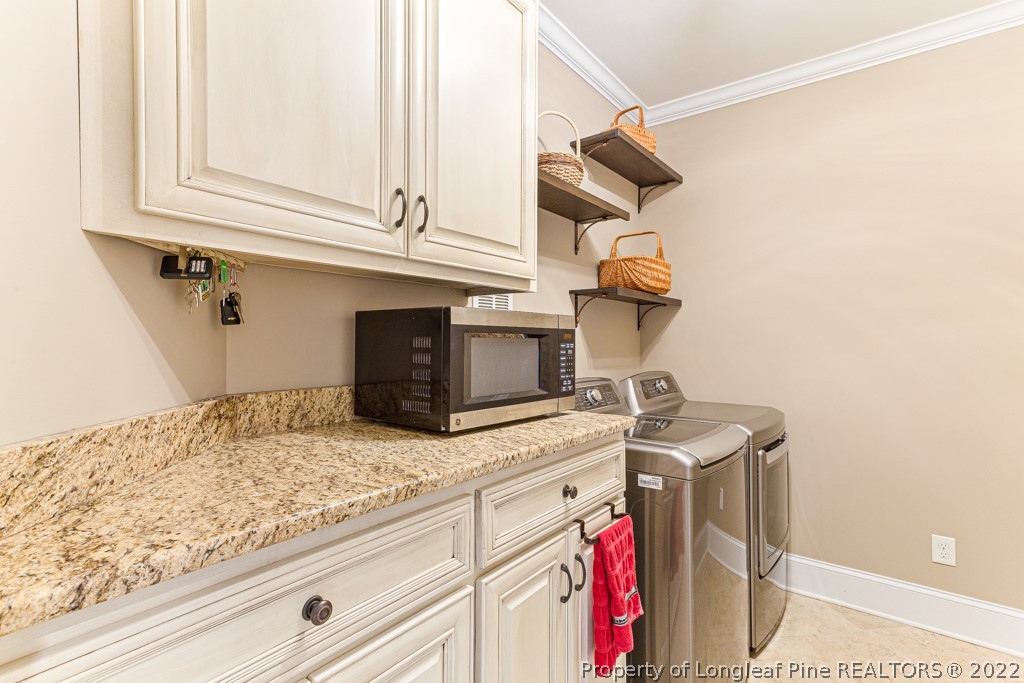375 East Lake Ridge Road Raeford, NC 28376 - Photo 17 of 50 a utility room with dryer and washer