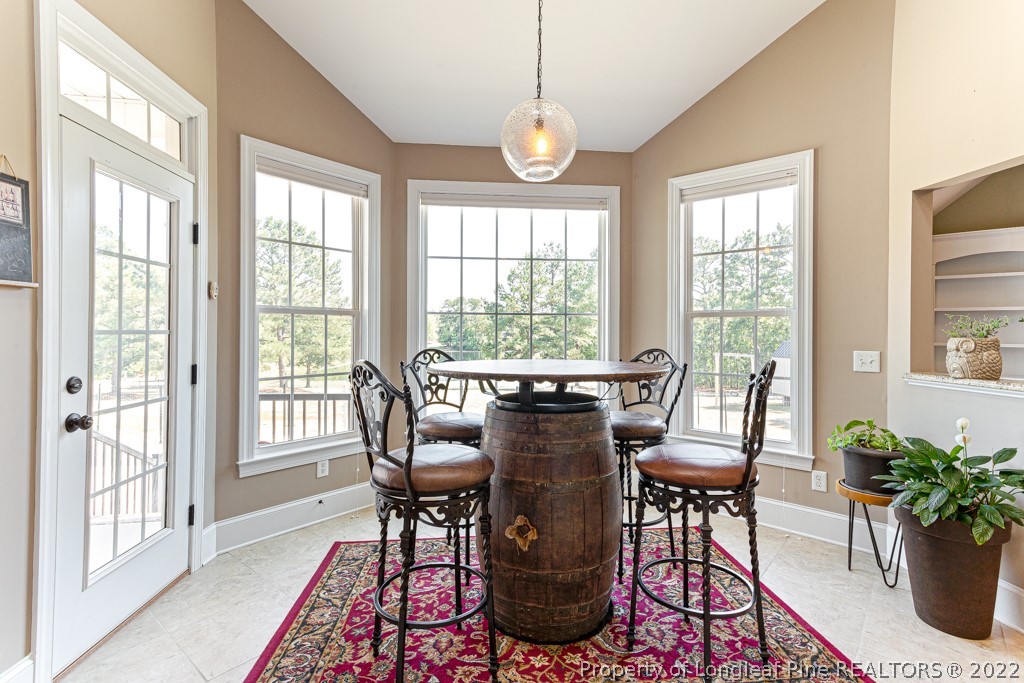 375 East Lake Ridge Road Raeford, NC 28376 - Photo 22 of 50 a view of a dining room with furniture window and outside view