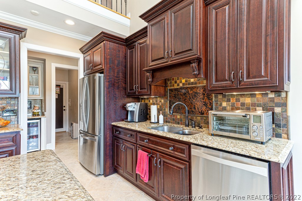 375 East Lake Ridge Road Raeford, NC 28376 - Photo 24 of 50 a kitchen with stainless steel appliances granite countertop a refrigerator and a sink